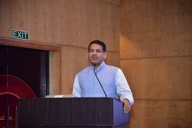 A person standing at a podiumAI-generated content may be incorrect.